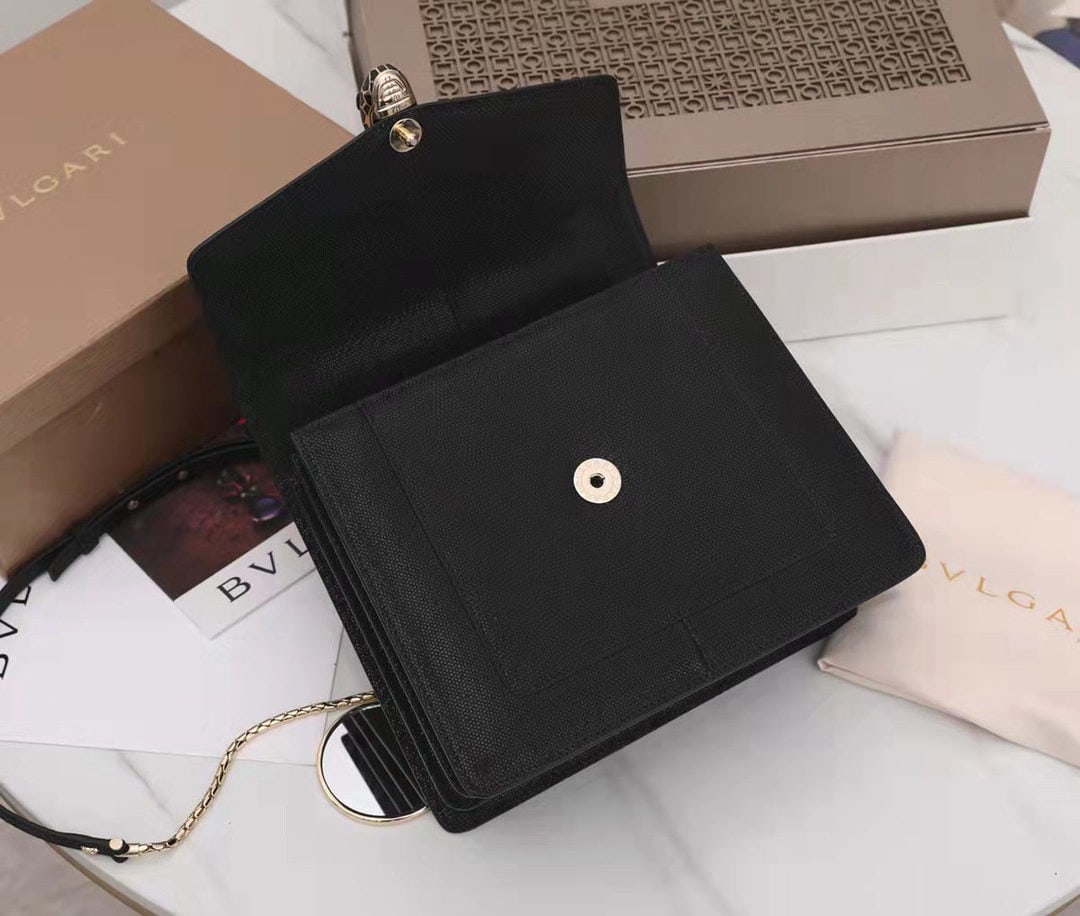 Bvlgari SERPENTI FOREVER: We offer FREE SHIPPING for both domestic and international clients who bid over $500. The Bvlgari SERPENTI FOREVER collection is crafted from precious black metallic calfskin, featuring shimmering cha