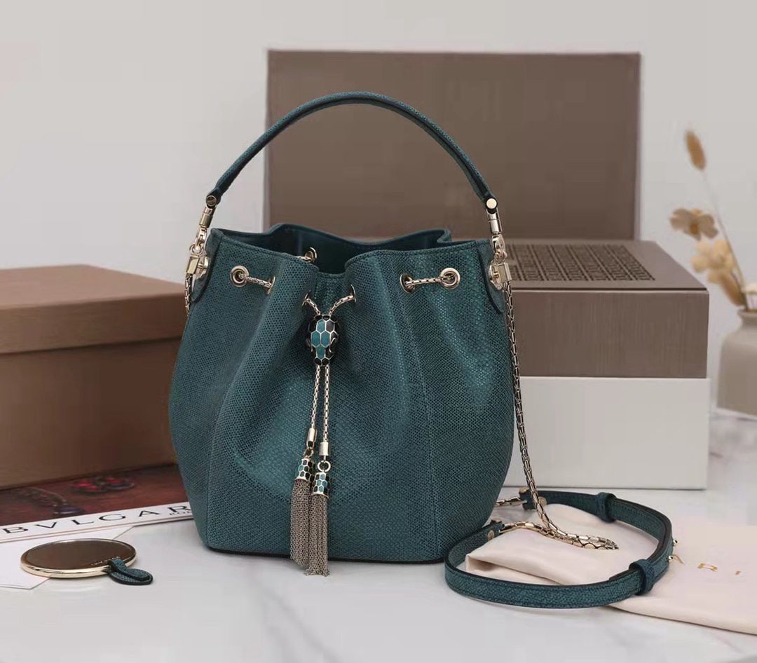 Bvlgari Serpenti Forever: We offer FREE SHIPPING for both domestic and international clients who bid over $500. The Bvlgari Serpenti Forever family welcomes a masterpiece: a stylish bucket bag. This bucket bag is crafted from 