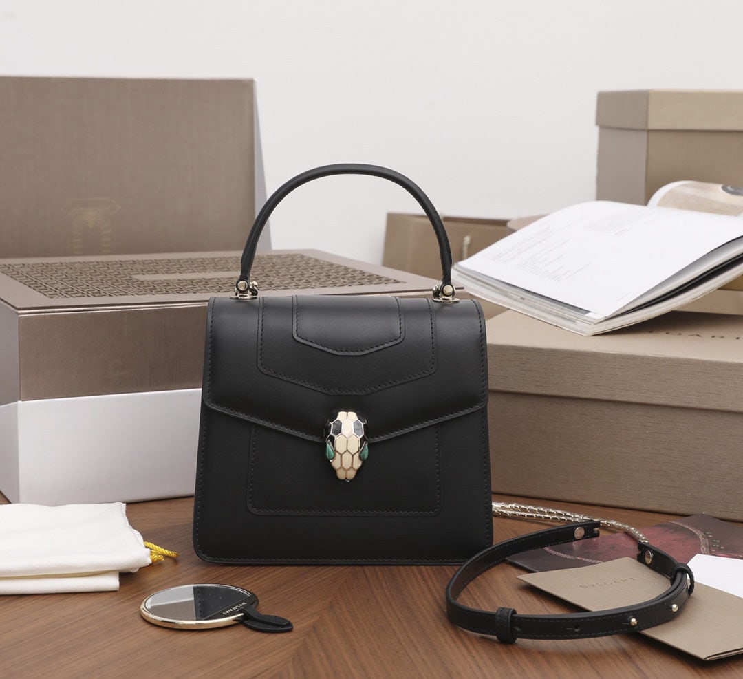 Bvlgari Serpenti Forever: We offer FREE SHIPPING for both domestic and international clients who bid over $500. The Bvlgari x Serpenti Forever collection features a malachite snake head design. The soft, lustrous black leather