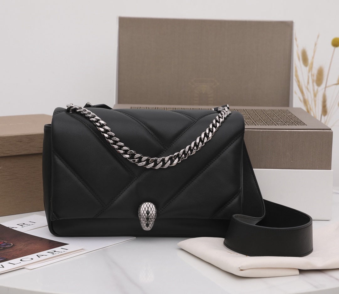 Bvlgari Serpenti Cabochon: We offer FREE SHIPPING for both domestic and international clients who bid over $500. The Bvlgari Serpenti Cabochon crossbody bag features a captivating oversized graphic pattern and bold metallic det