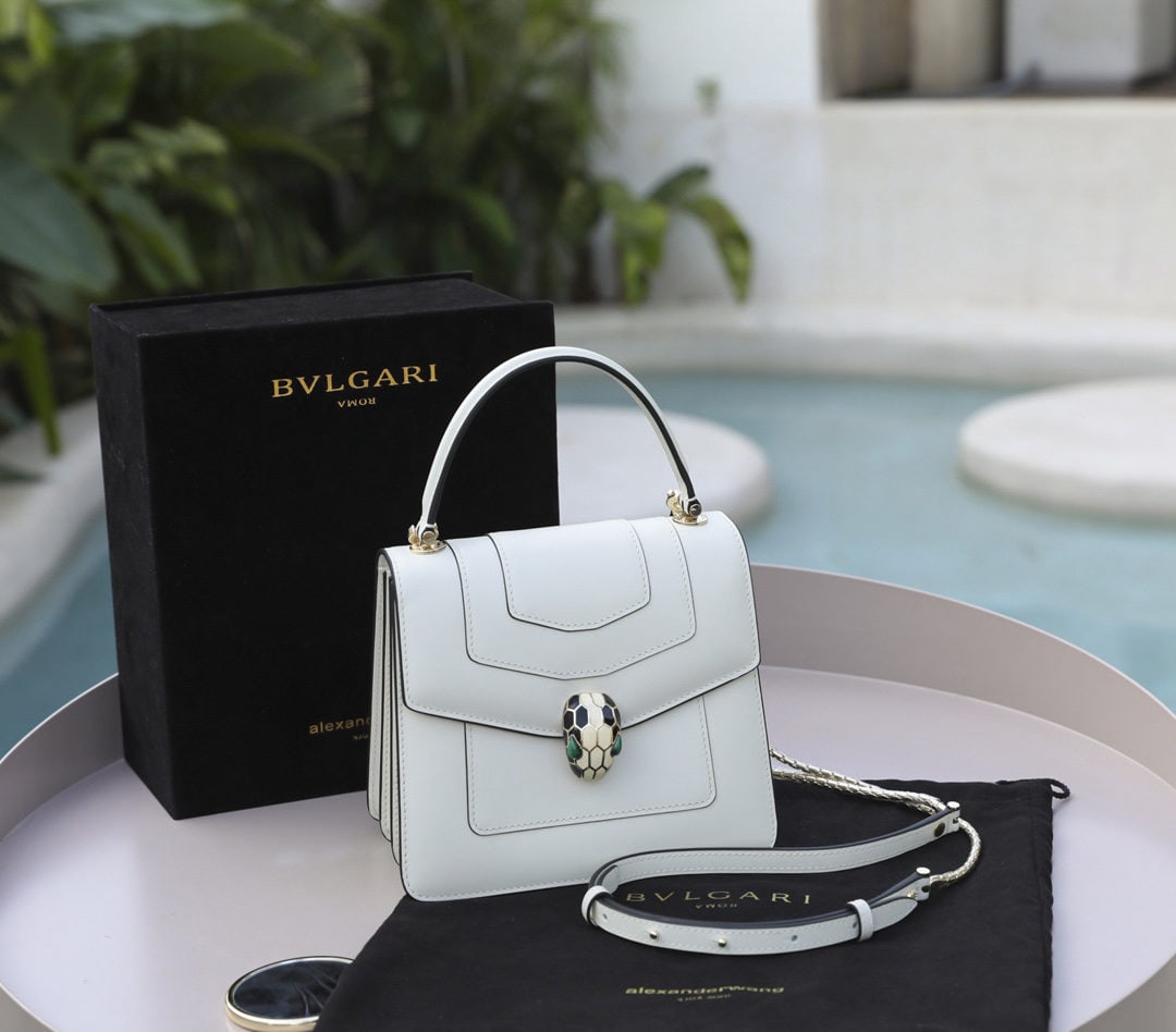 Bvlgari Serpenti Forever: We offer FREE SHIPPING for both domestic and international clients who bid over $500. The Bvlgari x Serpenti Forever collection features a popular pearl white leather that is soft, delicate, and lustr