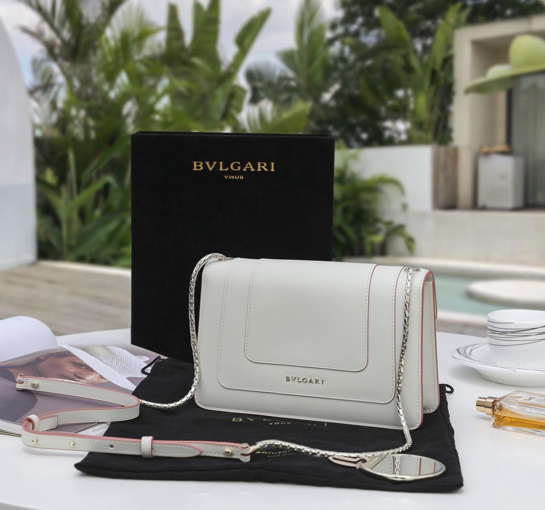 Bvlgari: We offer FREE SHIPPING for both domestic and international clients who bid over $500. Bvlgari Limited Edition Pink Pudding White with Pink Lambskin Lining: A perfect blend of girlish charm, elegance, 