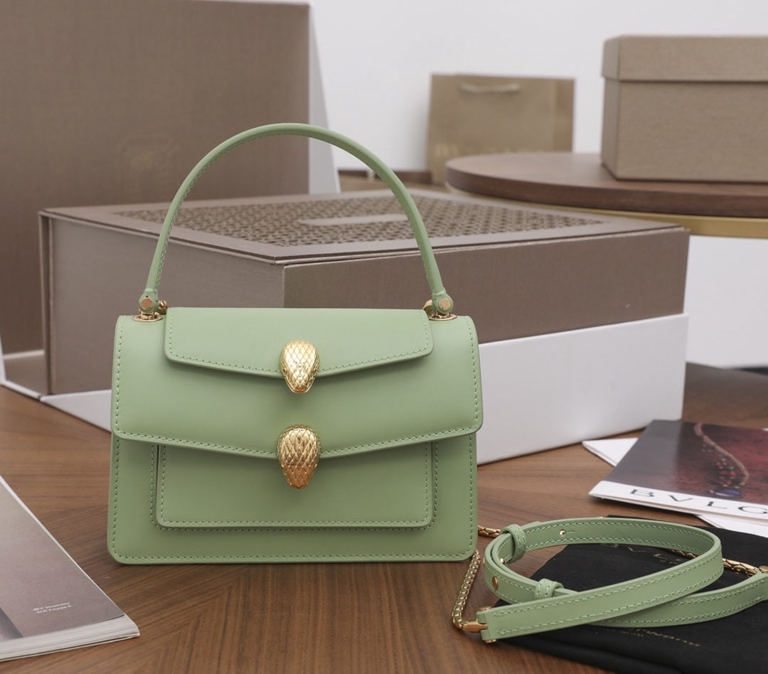 Bvlgari Alexander WanxX Bvlgari: We offer FREE SHIPPING for both domestic and international clients who bid over $500. The Alexander Wanx x Bvlgari limited edition bag features an antique-style double snake head clasp paired with cap