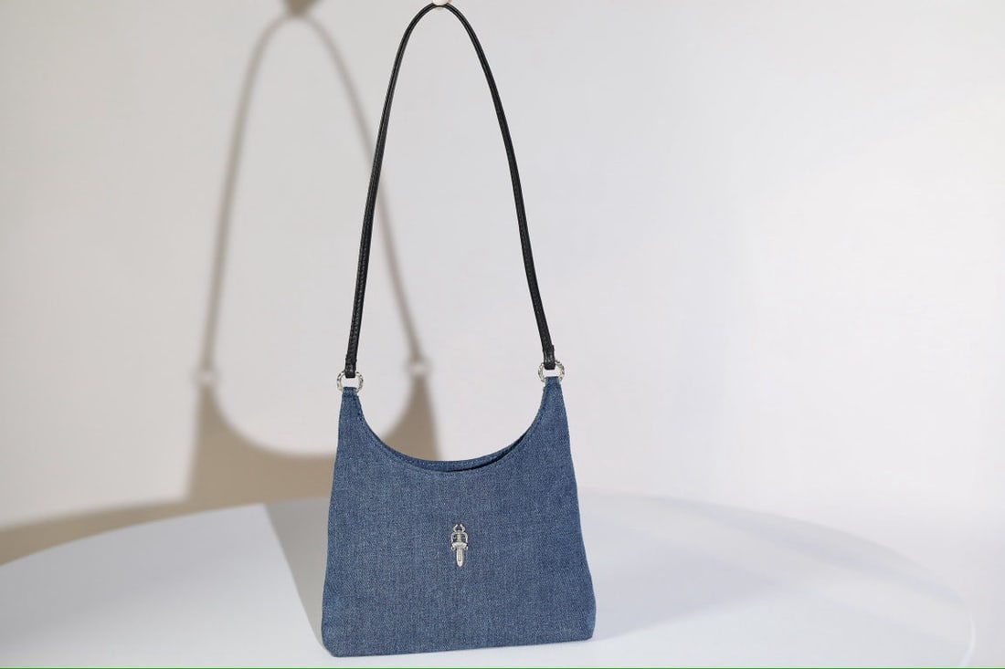 Chrome Hearts viv bag: We offer FREE SHIPPING for both domestic and international clients who bid over $500. Chrome Hearts Viv bag, a small sword-shaped underarm bag in denim and black leather (approximately 54g). Dimension