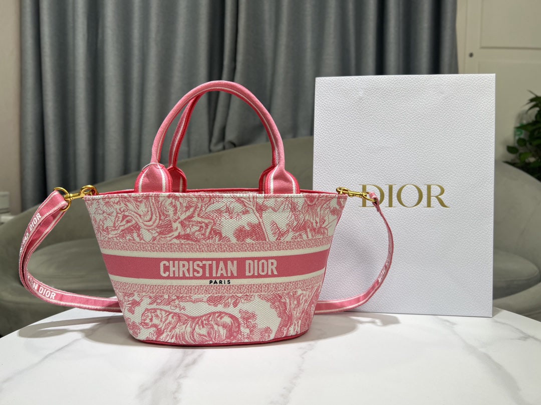 Christian Dior: We offer FREE SHIPPING for both domestic and international clients who bid over $500. This striking and stylish white basket bag features a fluorescent pink animal print embroidery. Its elegant silhou