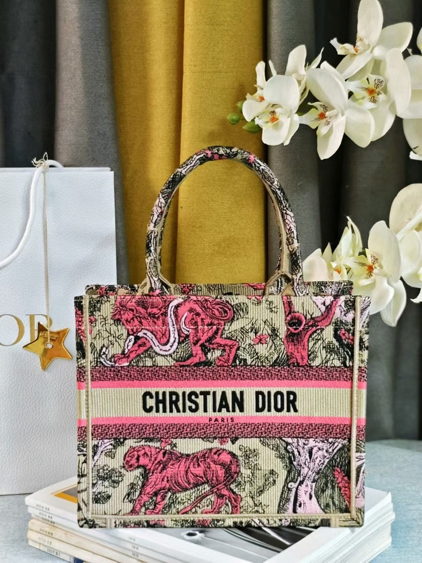 Christian Dior Book Tote: We offer FREE SHIPPING for both domestic and international clients who bid over $500. The Dior Book Tote handbag, designed by Women's Creative Director Maria Grazia Chiuri, is a key piece embodying ae