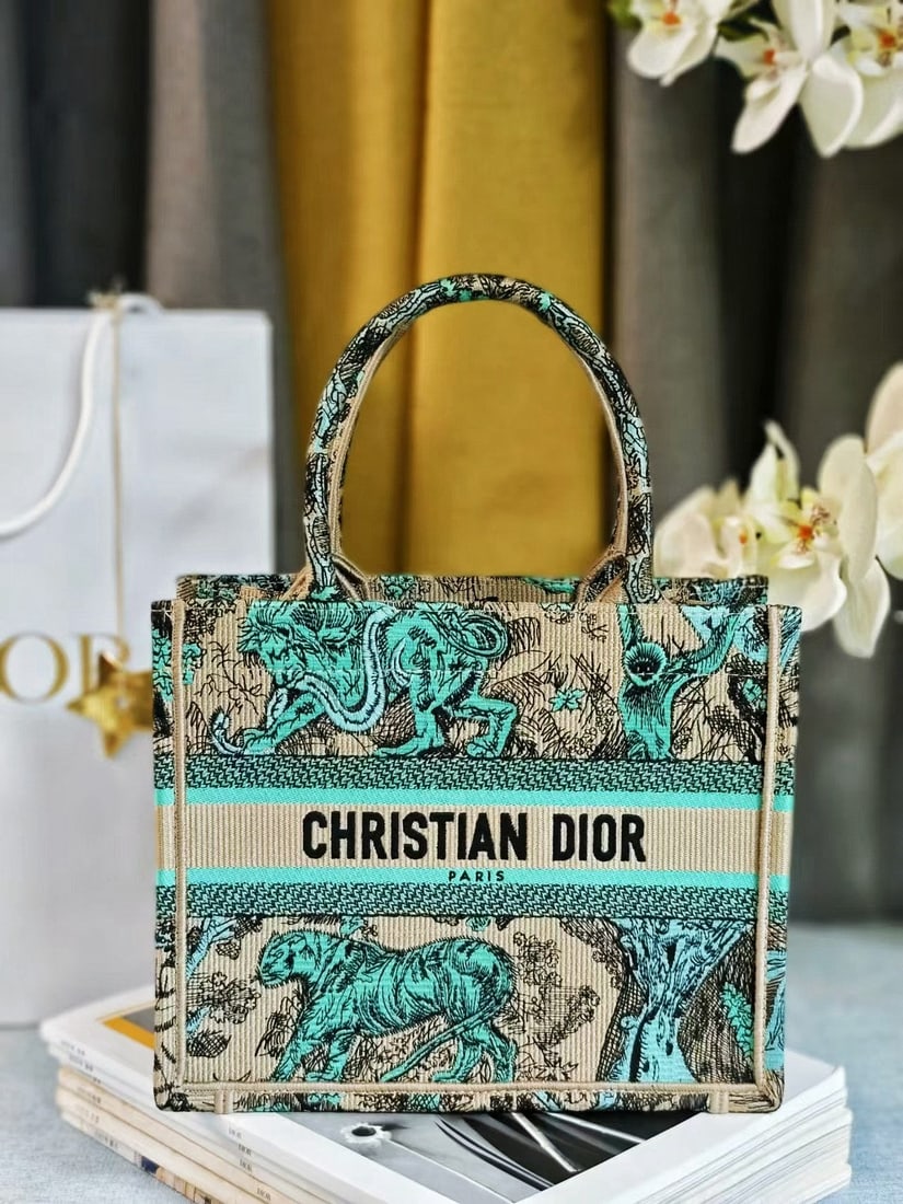 Christian Dior Book Tote: We offer FREE SHIPPING for both domestic and international clients who bid over $500. The Dior Book Tote handbag, designed by Women's Creative Director Maria Grazia Chiuri, is a key piece embodying ae