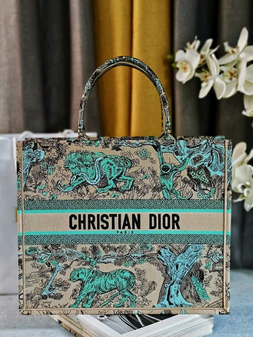 Christian Dior Book Tote: We offer FREE SHIPPING for both domestic and international clients who bid over $500. Designed by Women's Creative Director Maria Grazia Chiuri, the Dior Book Tote is a flagship product embodying aest