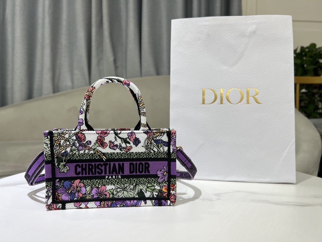 Christian Dior Book Tote: We offer FREE SHIPPING for both domestic and international clients who bid over $500. The mini purple sun Dior Book Tote is a classic original design by Christian Dior Creative Director Maria Grazia C