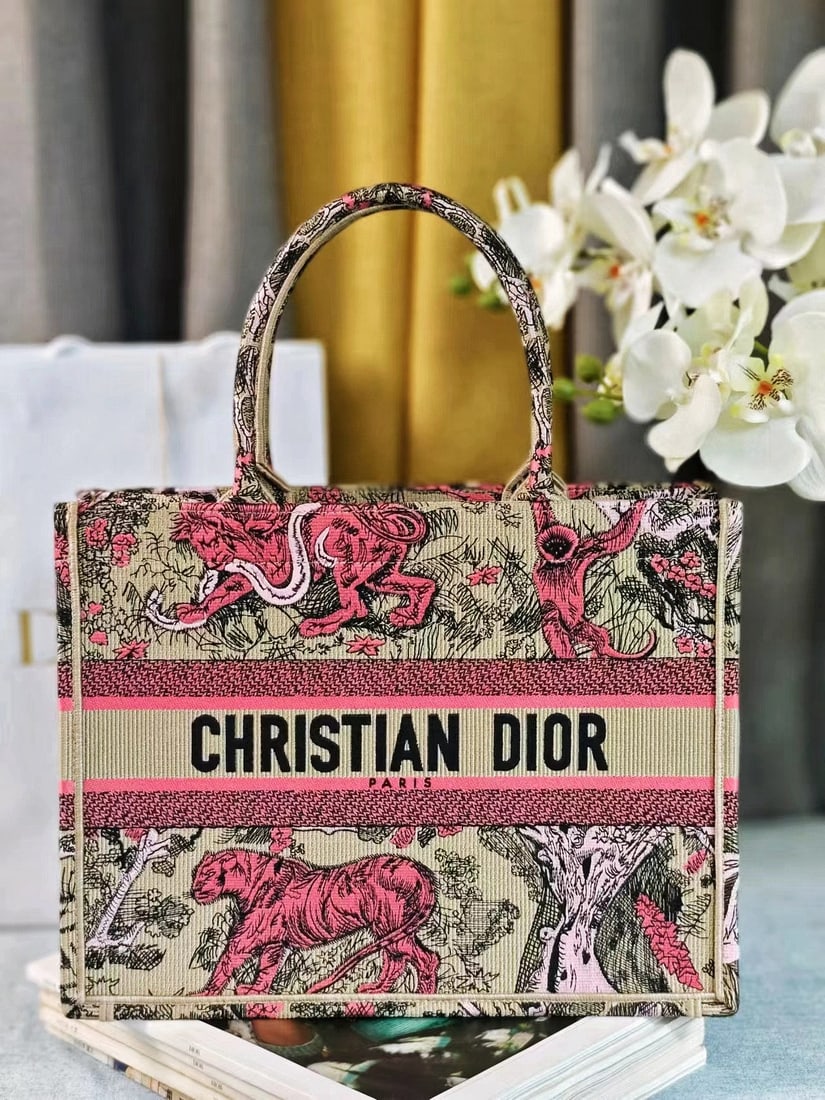 Christian Dior Book Tote: We offer FREE SHIPPING for both domestic and international clients who bid over $500. The Dior Book Tote, designed by Women's Creative Director Maria Grazia Chiuri, is a flagship product embodying aes
