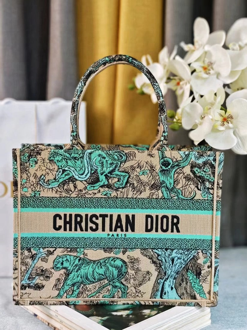 Christian Dior Book Tote: We offer FREE SHIPPING for both domestic and international clients who bid over $500. The Dior Book Tote, designed by Women's Creative Director Maria Grazia Chiuri, is a flagship product embodying aes