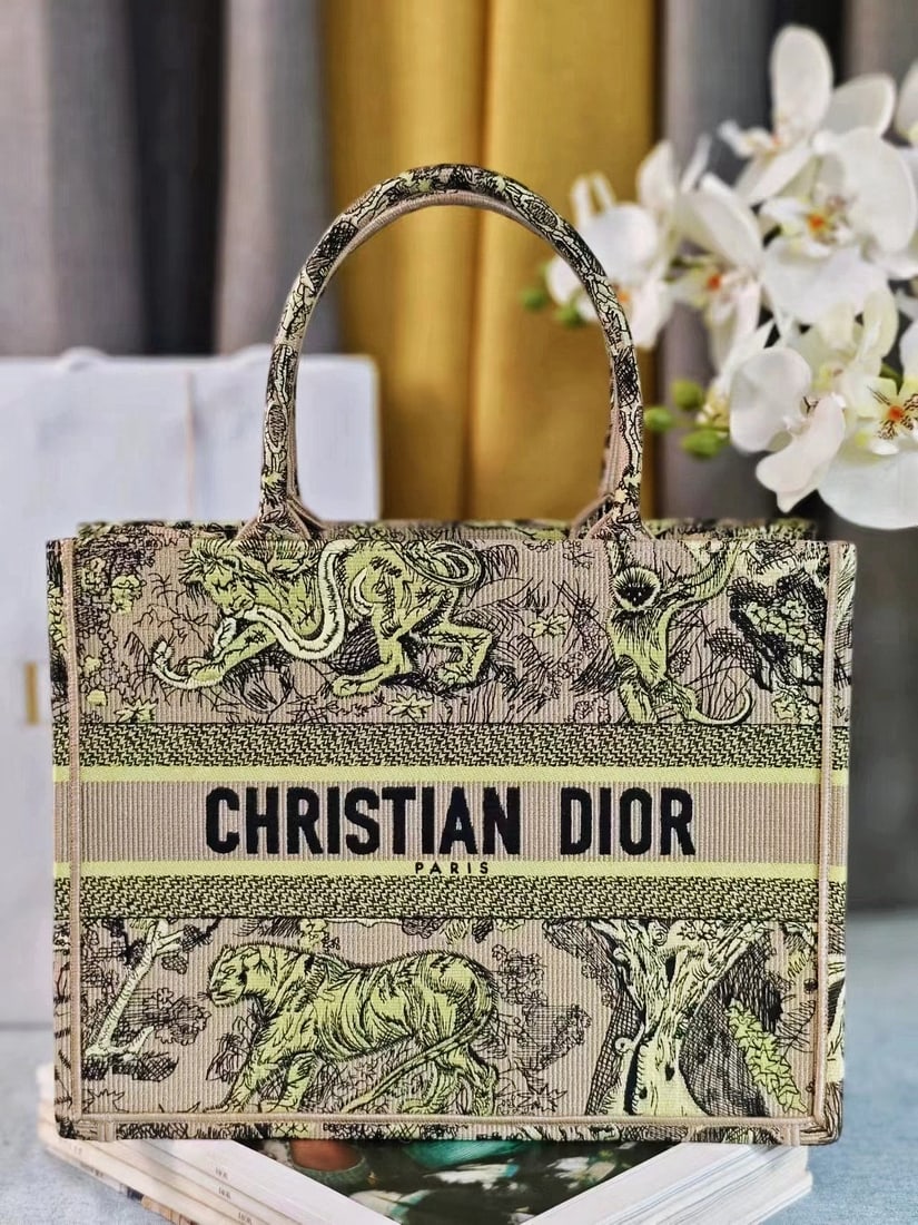 Christian Dior Book Tote: We offer FREE SHIPPING for both domestic and international clients who bid over $500. The Dior Book Tote handbag, designed by Women's Creative Director Maria Grazia Chiuri, is a key piece embodying ae