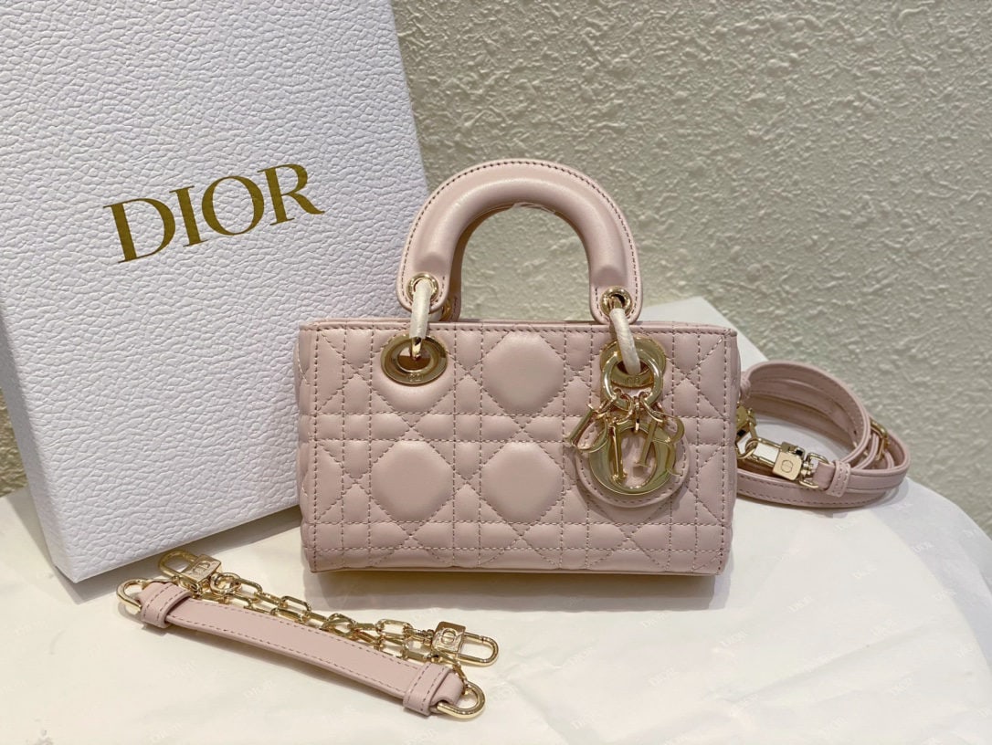 Christian Dior d-joy: We offer FREE SHIPPING for both domestic and international clients who bid over $500. The Dior d-joy mini Lady D-Joy handbag embodies Dior's profound understanding of elegance and beauty. This sophist
