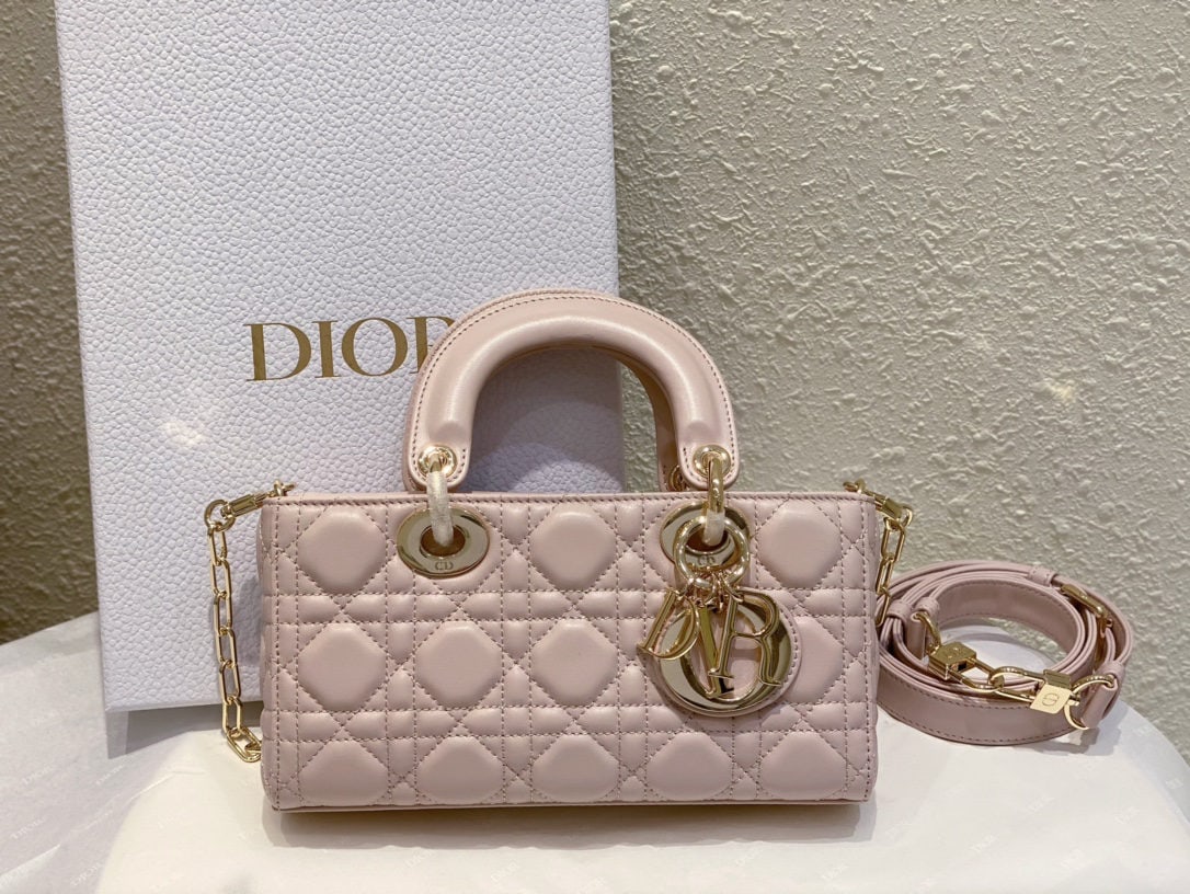 Christian Dior d-joy: We offer FREE SHIPPING for both domestic and international clients who bid over $500. The Dior d-joy Lady D-Joy handbag embodies Dior's profound understanding of elegance and beauty. This sophisticate