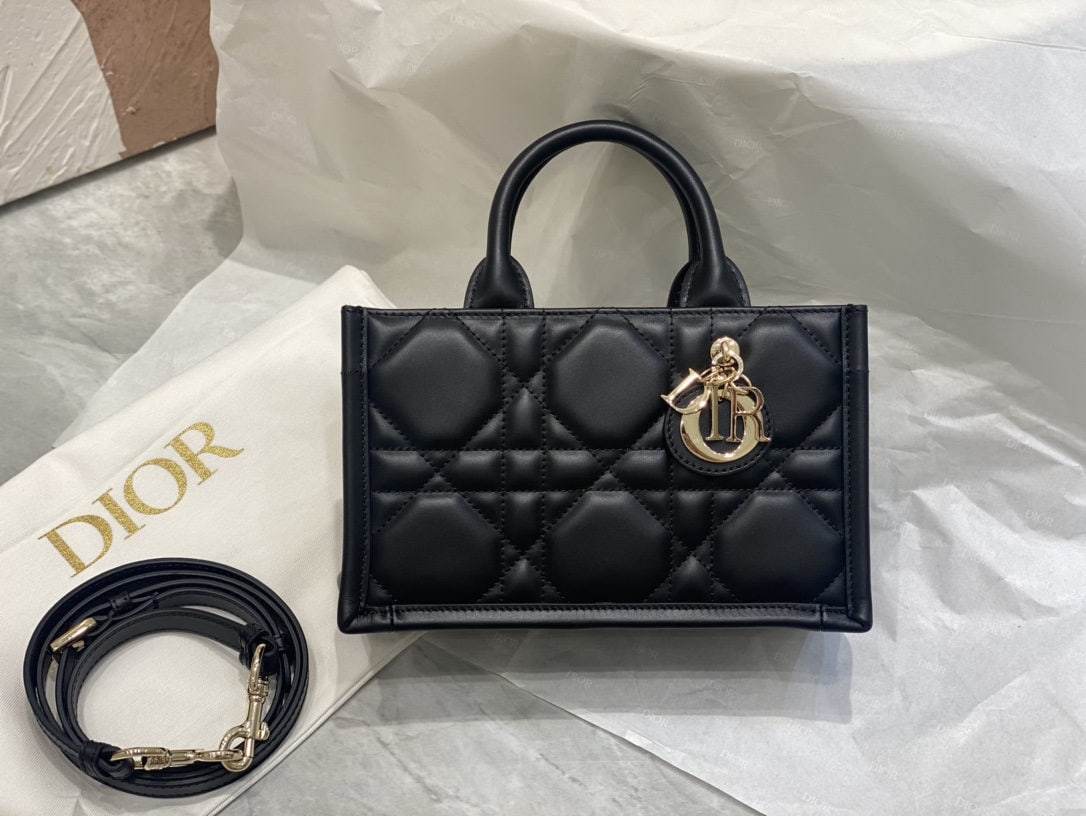 Christian Dior Book Tote: We offer FREE SHIPPING for both domestic and international clients who bid over $500. The black mini Dior Book Tote bag is a classic original design by Dior Creative Director Maria Grazia Chiuri. Craf