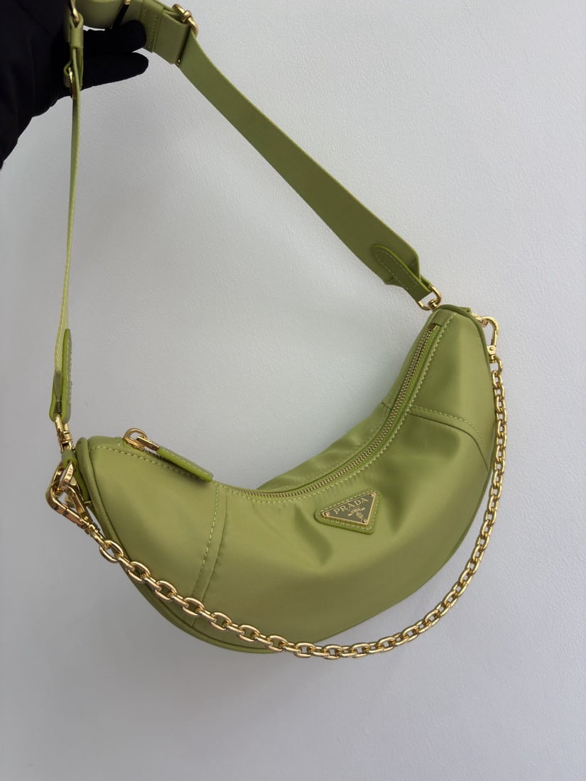 PRADA Crescent Bag Multifunctional: We offer FREE SHIPPING for both domestic and international clients who bid over $500. The Crescent Bag, a multi-functional Re-Nylon handbag, is crafted from recycled nylon. Exquisite and versatile,