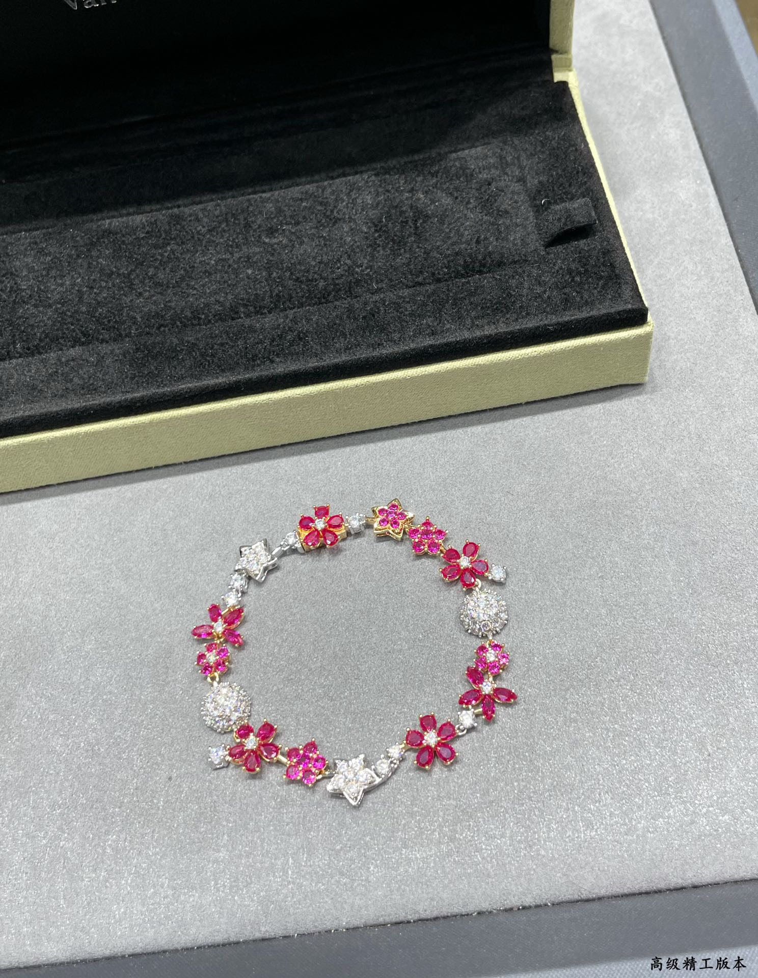 VCA Red Diamond Flower Bracelet: We offer FREE SHIPPING for both domestic and international clients who bid over $500. The VCA red diamond floral bracelet breaks away from the classic four-leaf clover design, making it exceptionally 