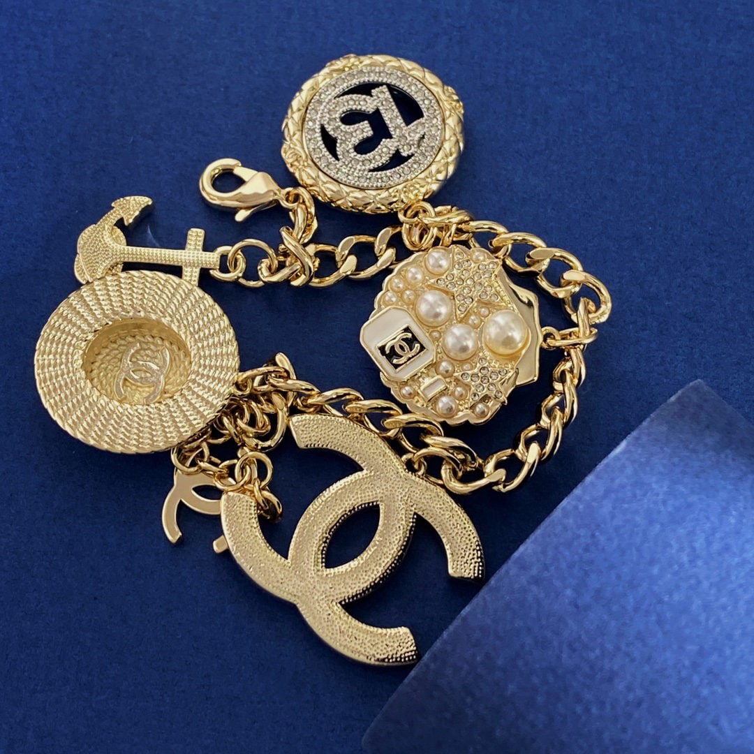 Chanel bracelet: We offer FREE SHIPPING for both domestic and international clients who bid over $500. Chanel multi-element diamond-encrusted number 13 round straw hat anchor shell oil blue striped double C flexible b