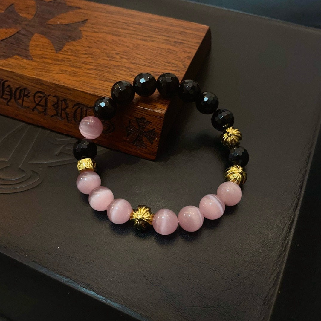 Chrome Hearts Bracelet: We offer FREE SHIPPING for both domestic and international clients who bid over $500. Chrome Hearts classic retro multi-element pink cat's eye bracelet with contrasting colors and textures, creating a