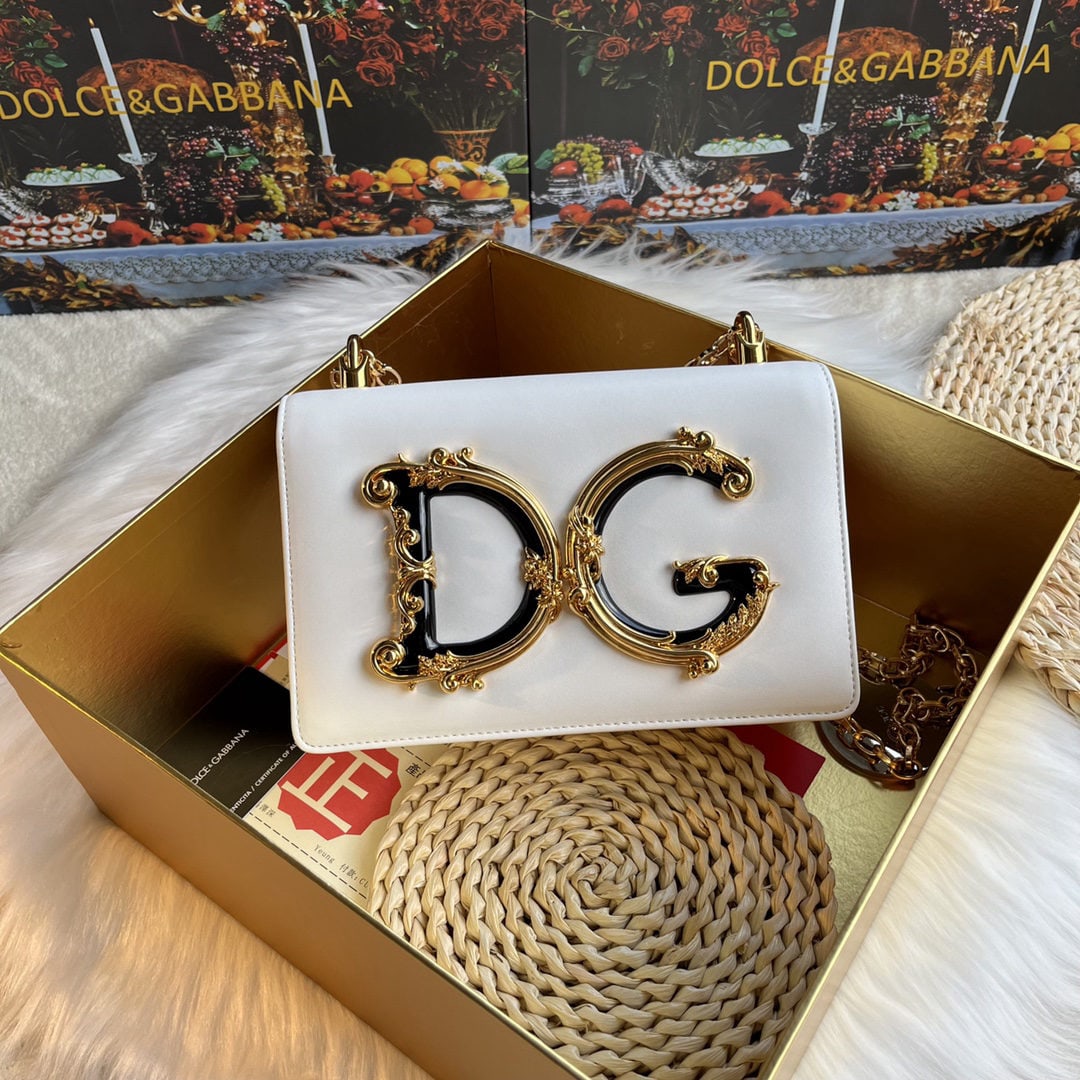 Dolce & Gabbana: We offer FREE SHIPPING for both domestic and international clients who bid over $500. This Dolce & Gabbana handcrafted crossbody bag features a resin base with a genuine gold-plated DG logo on the fro