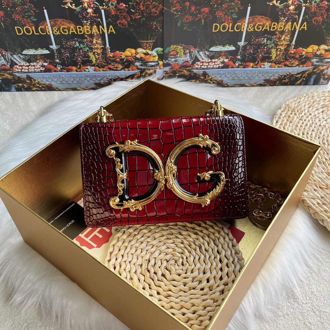 Dolce & Gabbana: We offer FREE SHIPPING for both domestic and international clients who bid over $500. Dolce & Gabbana crocodile-embossed crossbody bag. Exquisitely handcrafted, this crossbody bag features a resin bas