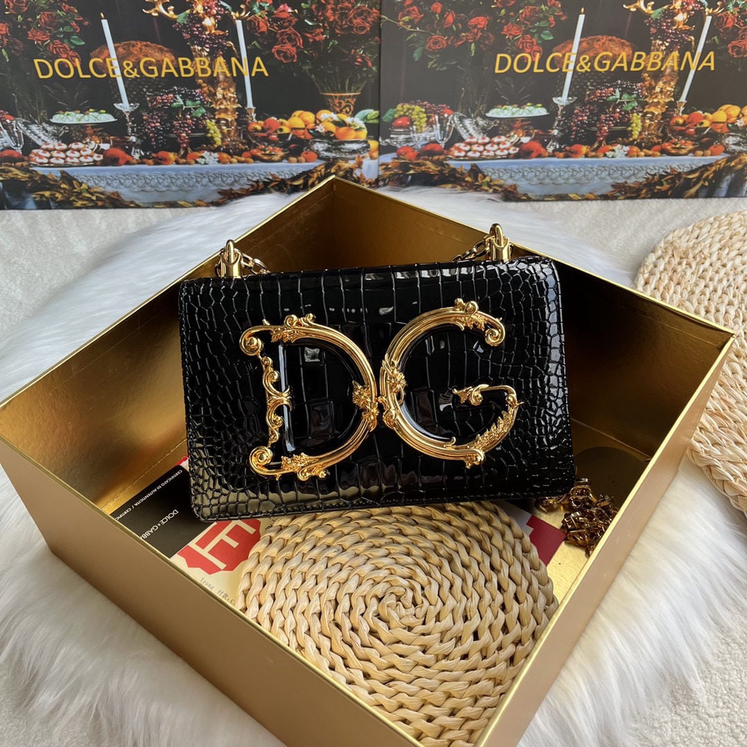Dolce & Gabbana: We offer FREE SHIPPING for both domestic and international clients who bid over $500. Dolce & Gabbana crocodile-embossed crossbody bag. Exquisitely handcrafted, this crossbody bag features a resin bas