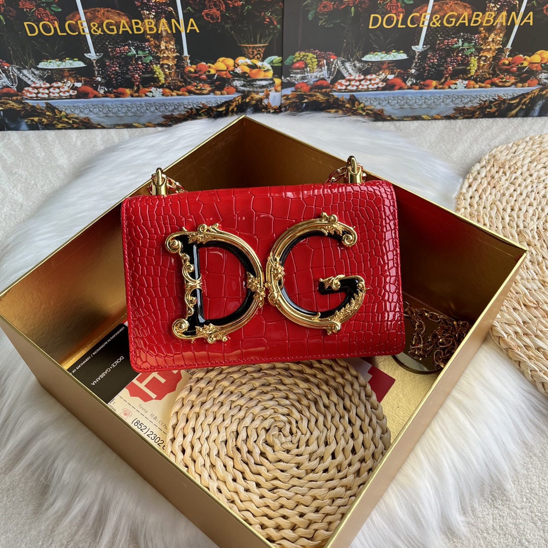 Dolce & Gabbana: We offer FREE SHIPPING for both domestic and international clients who bid over $500. Dolce & Gabbana crocodile-embossed crossbody bag. Exquisitely handcrafted, this crossbody bag features a resin bas
