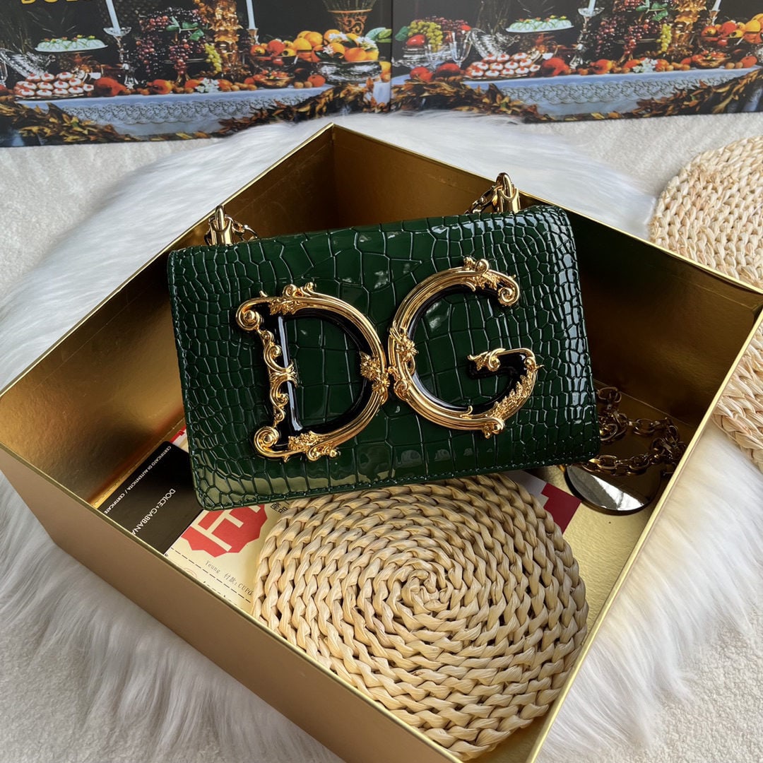 Dolce & Gabbana: We offer FREE SHIPPING for both domestic and international clients who bid over $500. Dolce & Gabbana crocodile-embossed crossbody bag. Exquisitely handcrafted, this crossbody bag features a resin bas