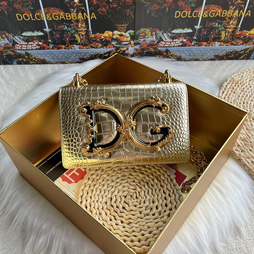 Dolce & Gabbana: We offer FREE SHIPPING for both domestic and international clients who bid over $500. Dolce & Gabbana crocodile-embossed crossbody bag. Exquisitely handcrafted, this crossbody bag features a resin bas