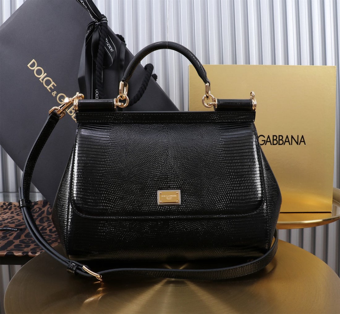 Dolce & Gabbana: We offer FREE SHIPPING for both domestic and international clients who bid over $500. The Dolce & Gabbana Sicily lizard-patterned gold-buckled lizard-patterned bag, a signature piece from the brand, i