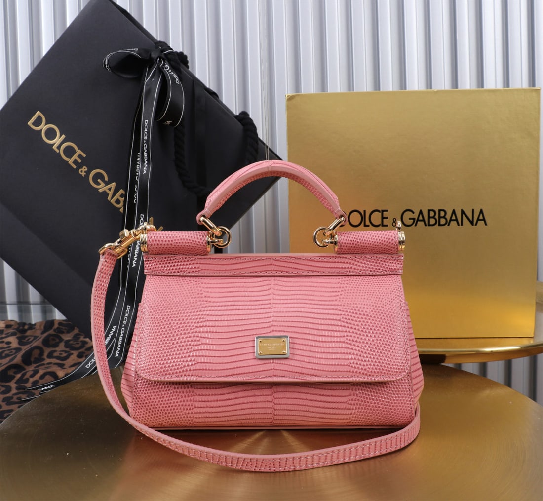 Dolce & Gabbana: We offer FREE SHIPPING for both domestic and international clients who bid over $500. The Dolce & Gabbana Sicily lizard-print gold-buckle design, a signature piece from the brand, is now presented in 