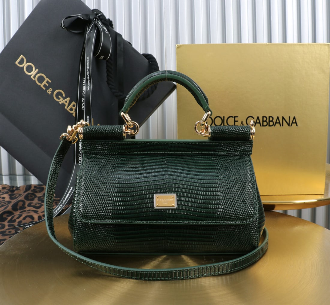 Dolce & Gabbana: We offer FREE SHIPPING for both domestic and international clients who bid over $500. The Dolce & Gabbana Sicily lizard-patterned gold-buckled lizard-patterned bag, a signature design, is now presente