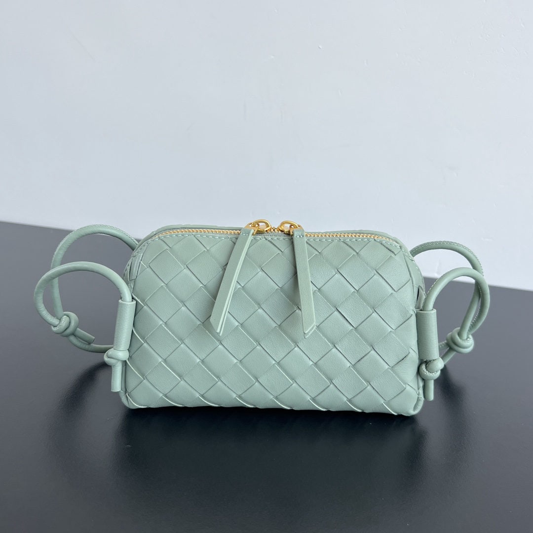 Bottega Veneta Concert pouch: We offer FREE SHIPPING for both domestic and international clients who bid over $500. The Bottega Veneta Concert Pouch is the most beautiful and practical mini bag I've ever seen. It features the clas