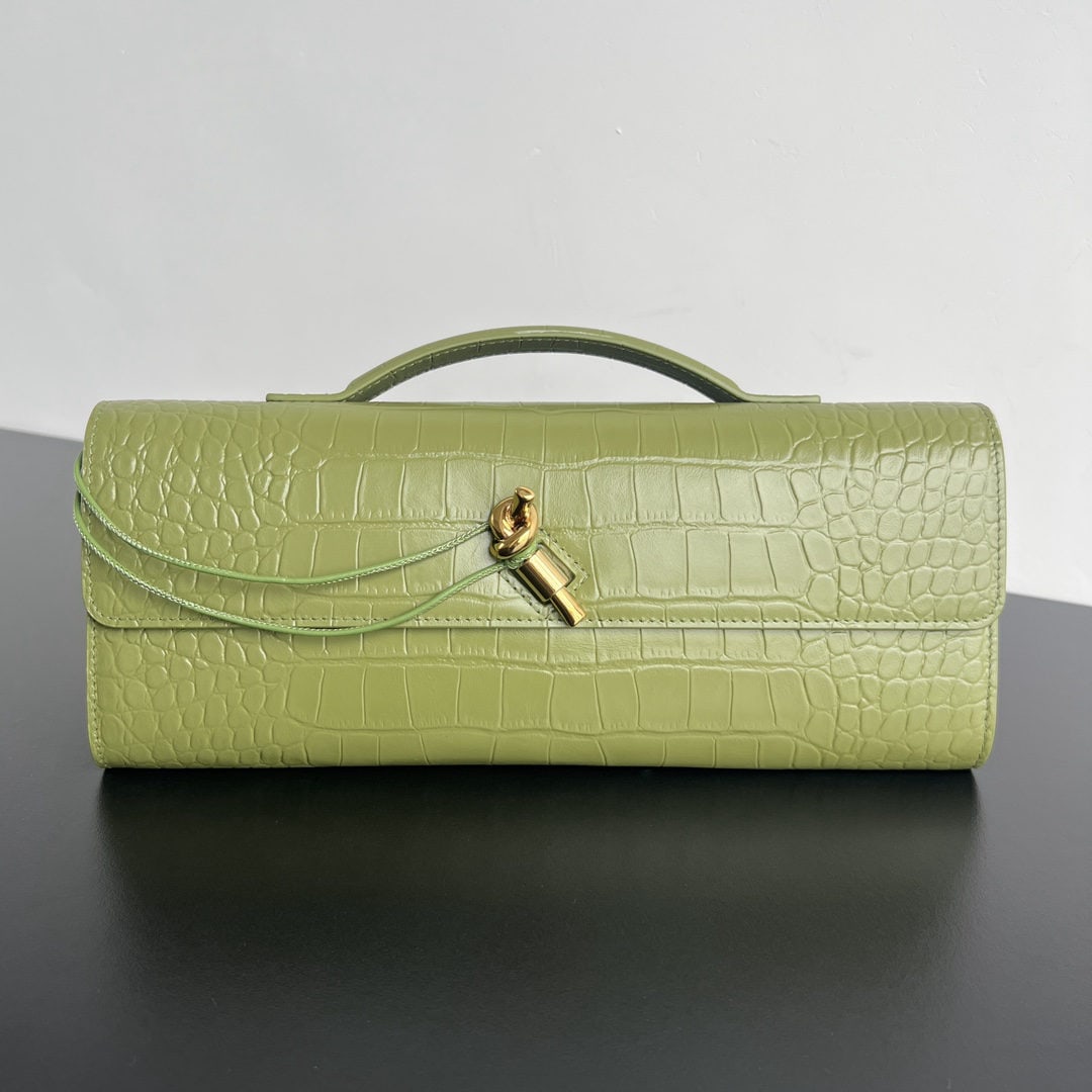 Bottega Veneta: We offer FREE SHIPPING for both domestic and international clients who bid over $500. This Bottega Veneta crocodile-embossed long clutch features a handle. The design exudes sophistication and high-en