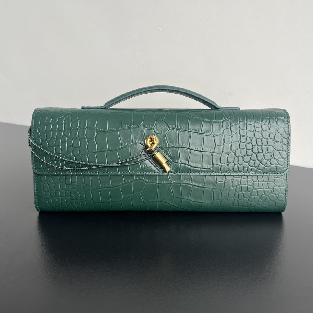 Bottega Veneta: We offer FREE SHIPPING for both domestic and international clients who bid over $500. This Bottega Veneta crocodile-embossed long clutch features a handle. The design exudes sophistication and high-en