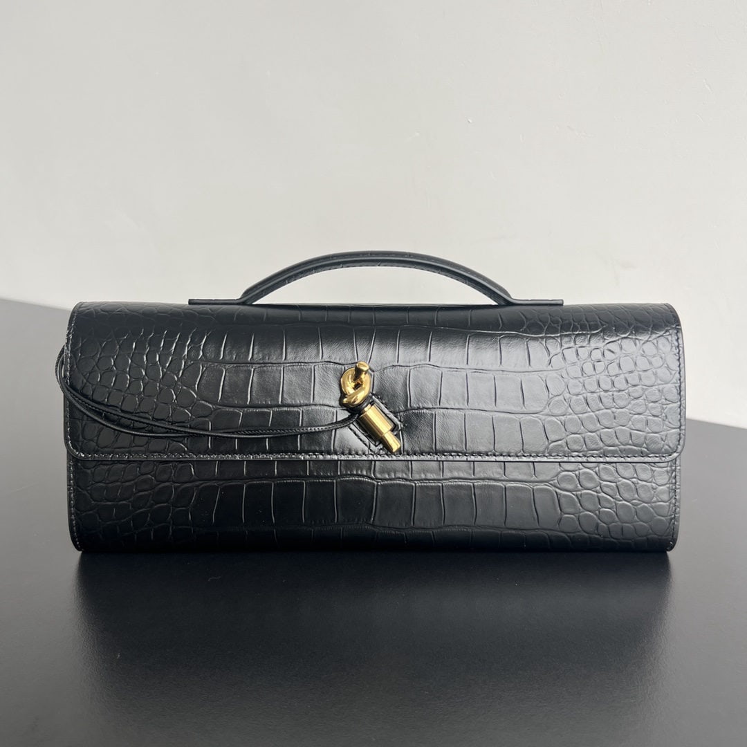 Bottega Veneta: We offer FREE SHIPPING for both domestic and international clients who bid over $500. This Bottega Veneta crocodile-embossed long clutch features a handle. The design exudes sophistication and high-en