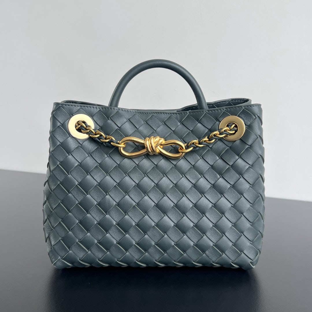 Bottega Veneta: We offer FREE SHIPPING for both domestic and international clients who bid over $500. The Bottega Veneta Andiamo's upgraded black and gold chain adds a touch of sophistication. The lambskin woven leat