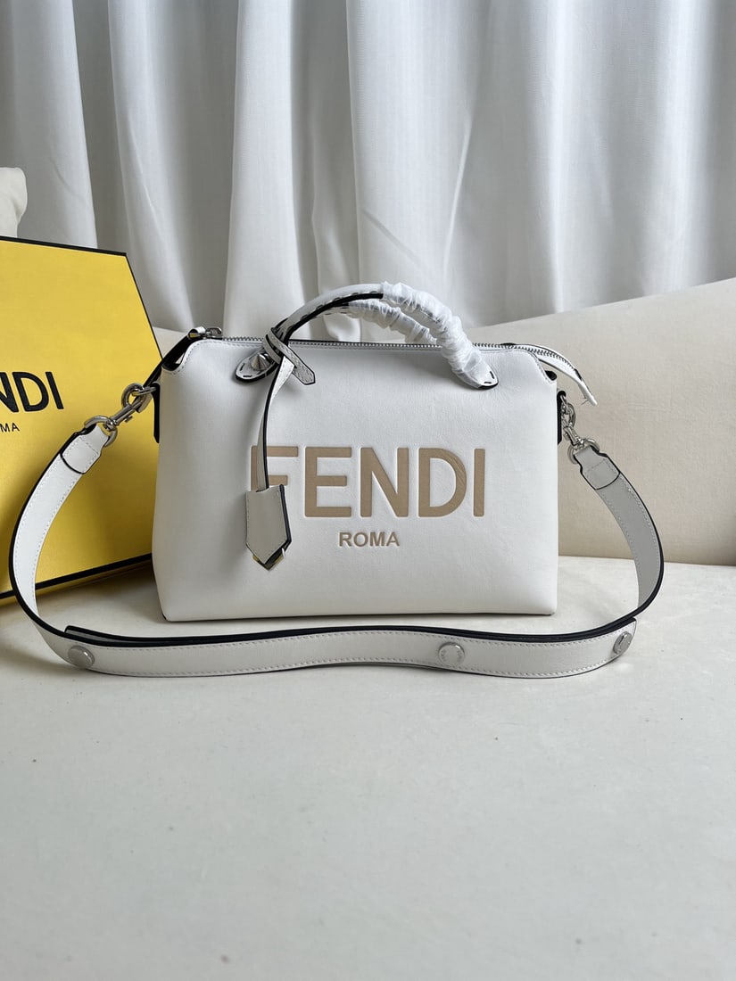 Fendi ?BY THE WAY: We offer FREE SHIPPING for both domestic and international clients who bid over $500. White BY THE WAY zip-lock Boston tote bag with a double-handle design and decorative plaque. The interior