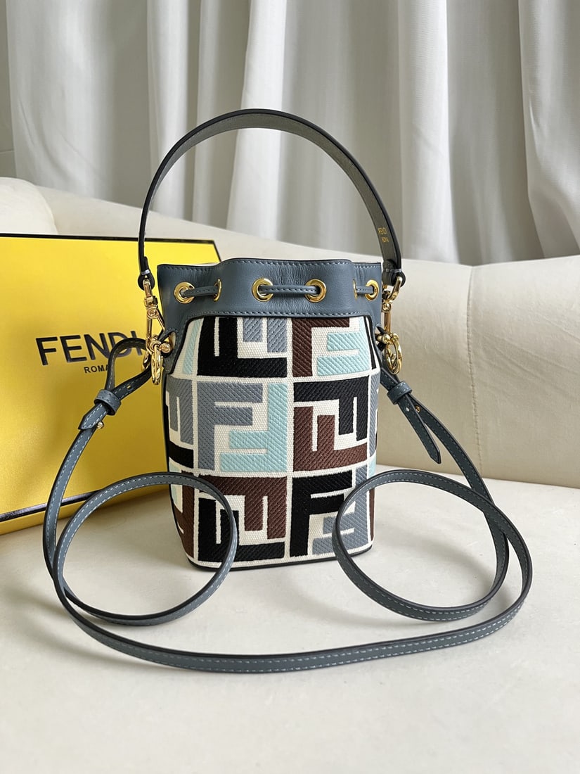 Fendi Mon Tresor: We offer FREE SHIPPING for both domestic and international clients who bid over $500. Blue Mon Tresor mini bucket bag in light blue leather. Features a drawstring closure and Fendi logo hardware. Come