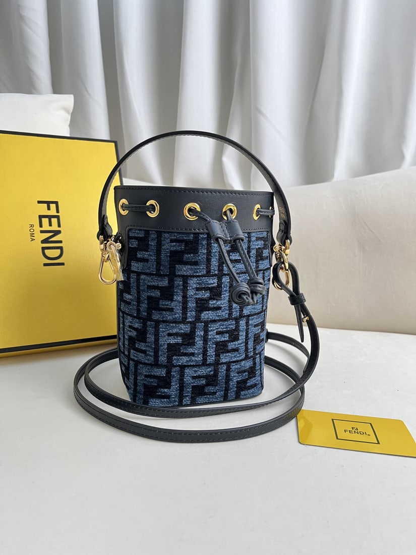 Fendi Mon Tresor: We offer FREE SHIPPING for both domestic and international clients who bid over $500. Blue Mon Tresor mini bucket bag in light blue leather. Features a drawstring closure and Fendi logo hardware. Come