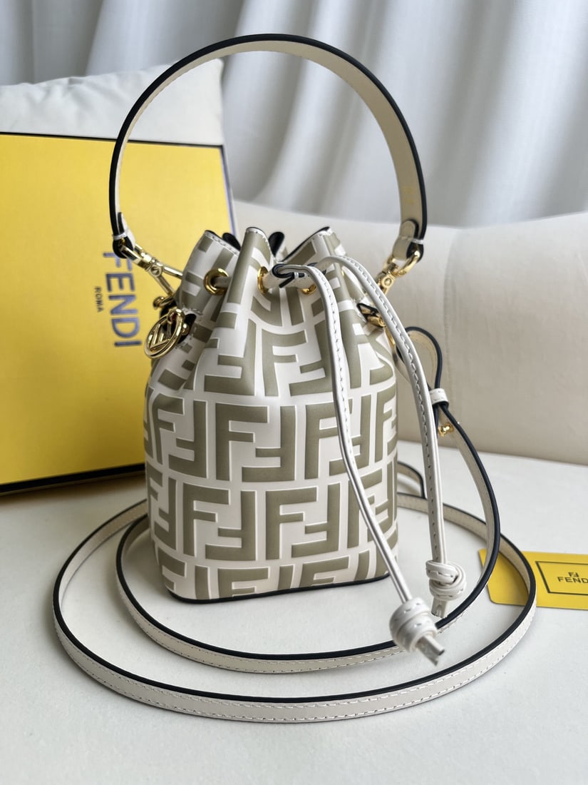Fendi Mon Tresor: We offer FREE SHIPPING for both domestic and international clients who bid over $500. White embossed Mon Tresor light blue leather mini handbag. A small Mon Tresor bucket bag with a drawstring and Fen