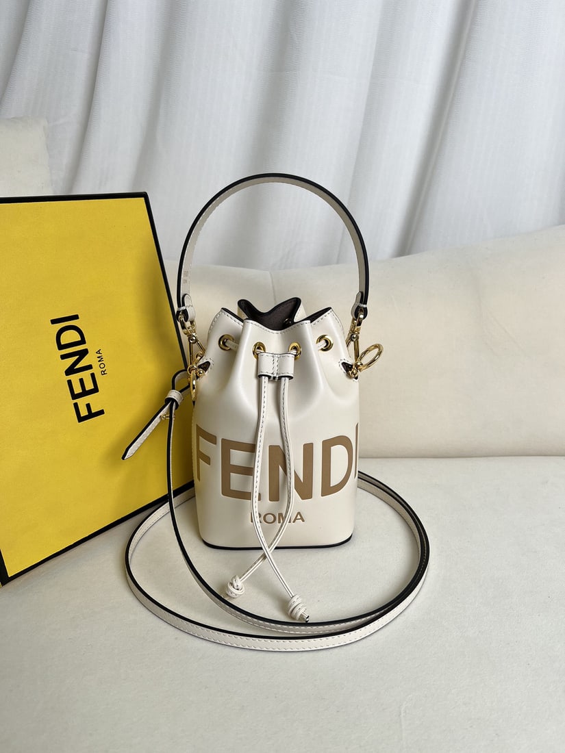 Fendi Mon Tresor: We offer FREE SHIPPING for both domestic and international clients who bid over $500. White Mon Tresor light blue leather mini handbag. A small Mon Tresor bucket bag with a drawstring and Fendi metal 