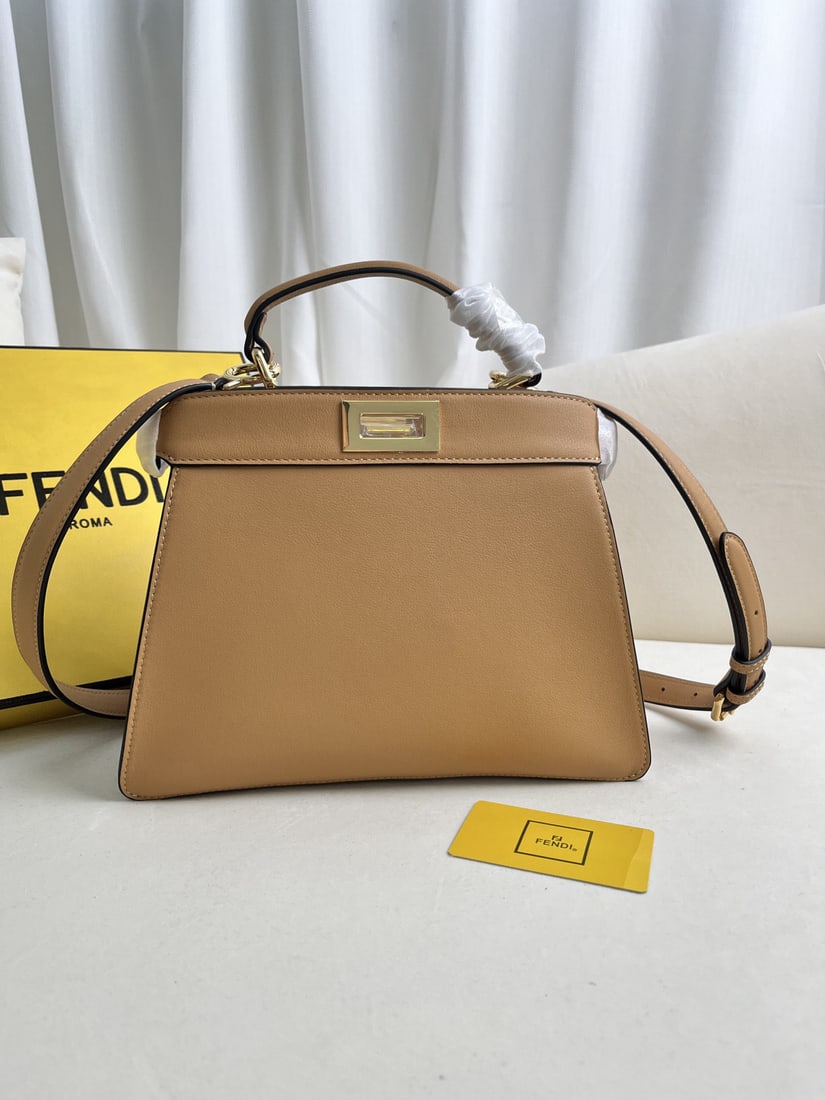 Fendi Peekaboo ISeeU: We offer FREE SHIPPING for both domestic and international clients who bid over $500. The Iconic Peekaboo ISeeU medium-sized leather handbag is made of brown leather with classic twist locks on both s