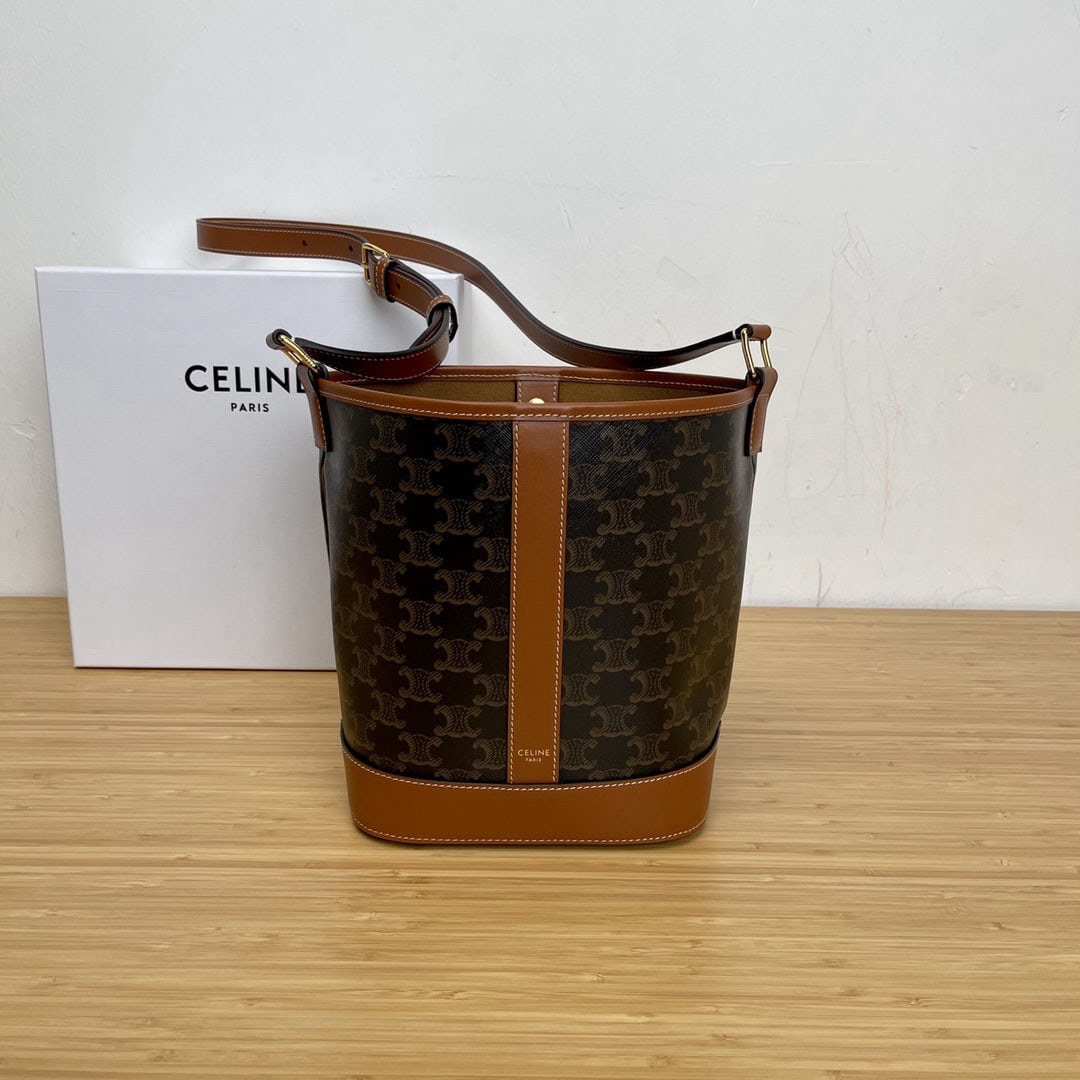 Celine Small Logo Print Bucket Bag: We offer FREE SHIPPING for both domestic and international clients who bid over $500. Small logo-print bucket bag, tan, 12 x 9 x 5 inches (30 x 22 x 13 cm). Made of faux cowhide leather with fabric li