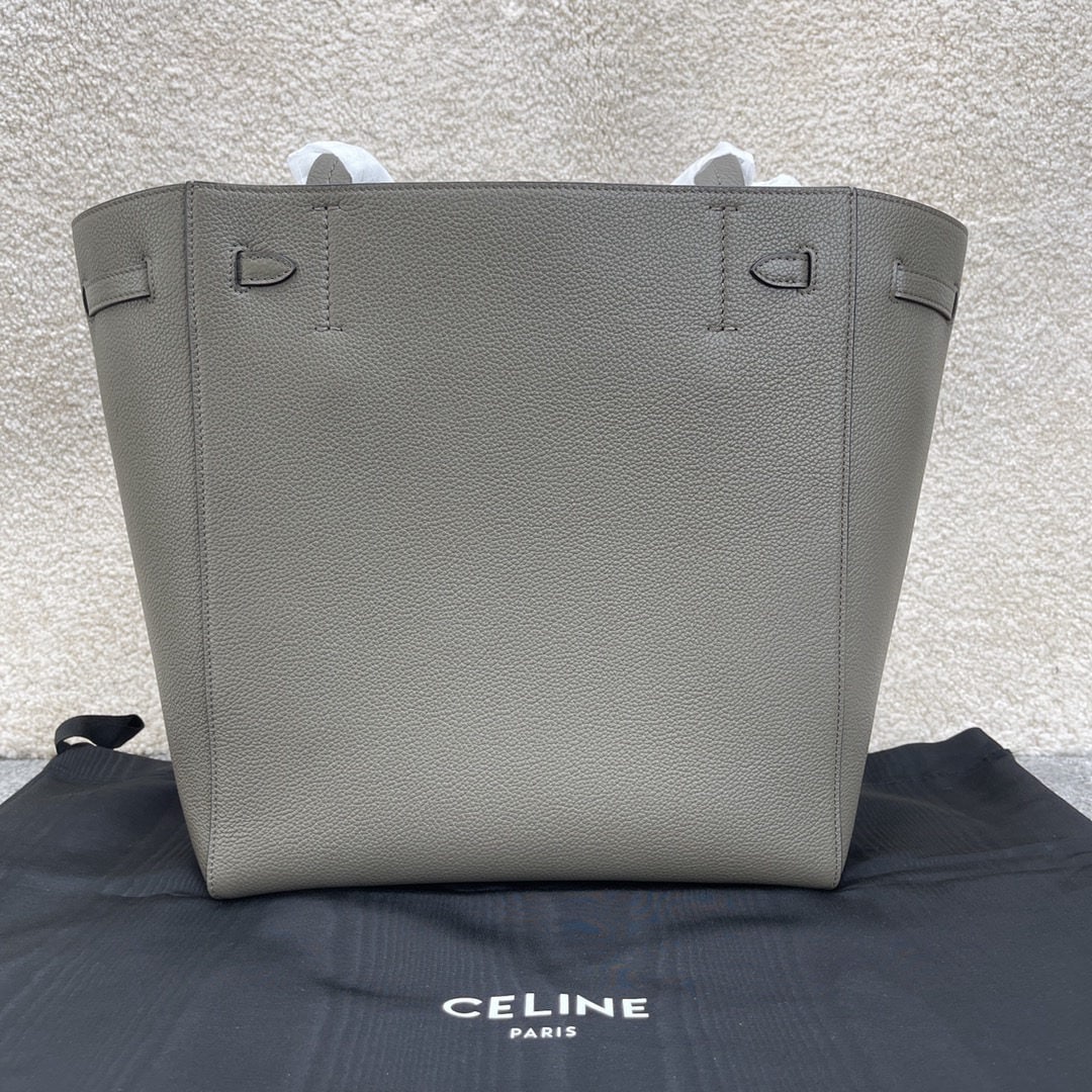 Celine: We offer FREE SHIPPING for both domestic and international clients who bid over $500. CABAS PHANTOM Small Elephant Grey Soft Grained Calfskin Shoulder Bag with Leather Handles and Drawstring Closure.