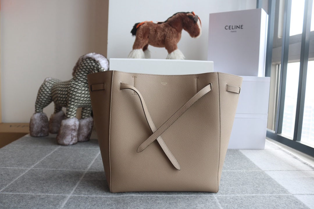 Celine: We offer FREE SHIPPING for both domestic and international clients who bid over $500. CABAS PHANTOM Small Apricot Soft Grained Calfskin Shoulder Bag with Leather Handles and Drawstring Closure. 11 x