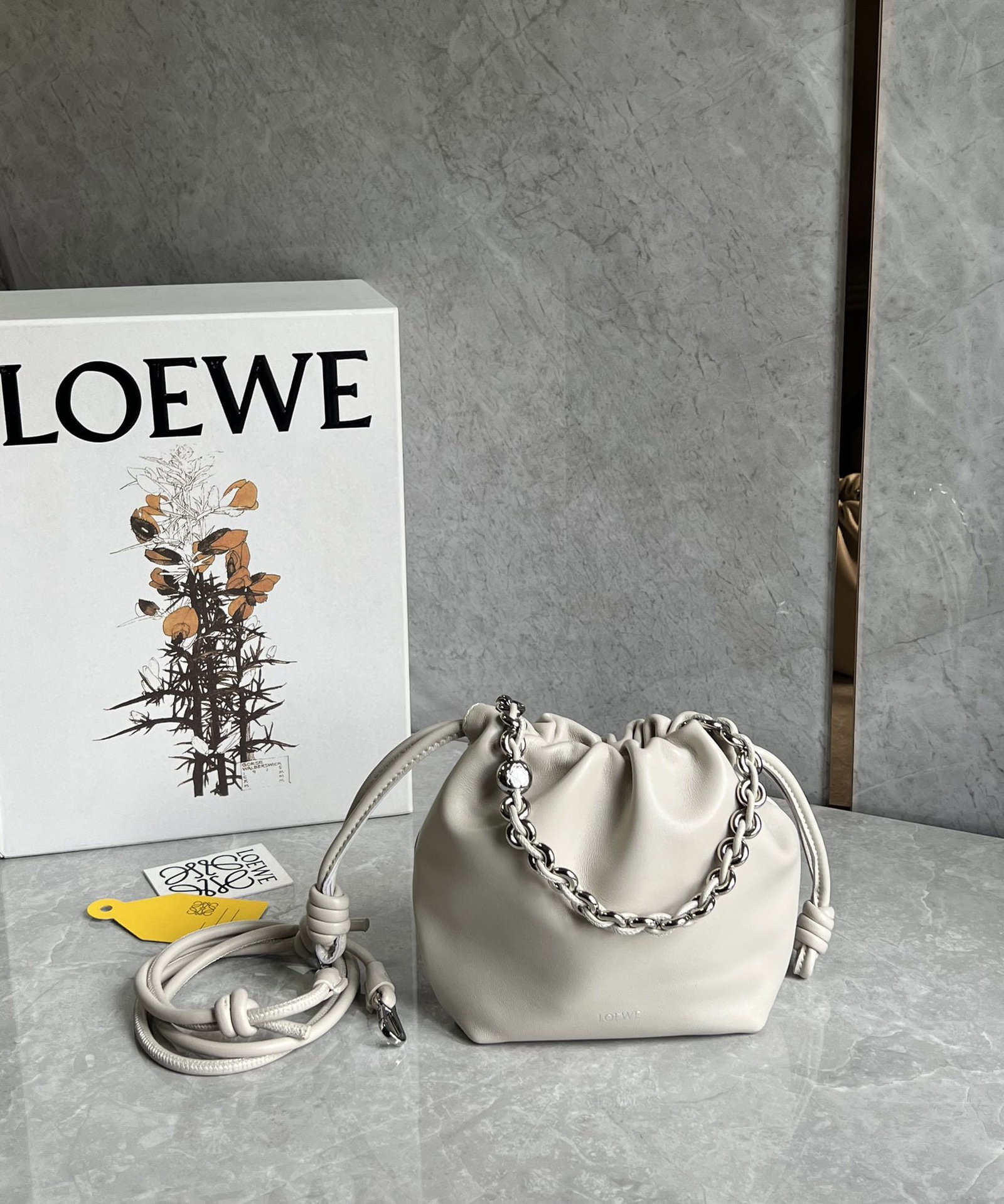 LOEWE Flamenco Purse: We offer FREE SHIPPING for both domestic and international clients who bid over $500. LOEWE Flamenco Purse Lucky Bag in Salt White? Features a pleated design and soft lambskin with a premium feel.