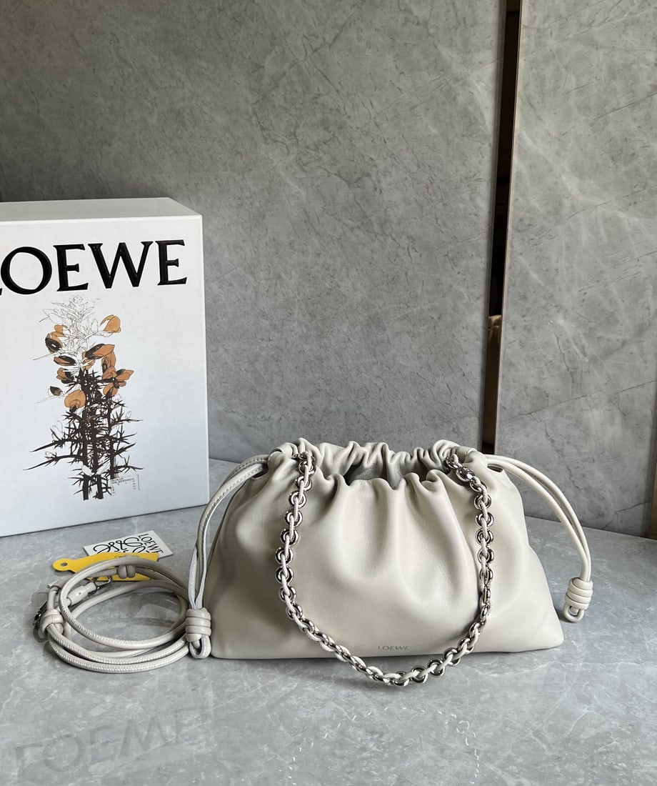 LOEWE Flamenco Purse: We offer FREE SHIPPING for both domestic and international clients who bid over $500. LOEWE Flamenco Purse Lucky Bag in Salt White? Features a pleated design and soft lambskin texture. The iconic