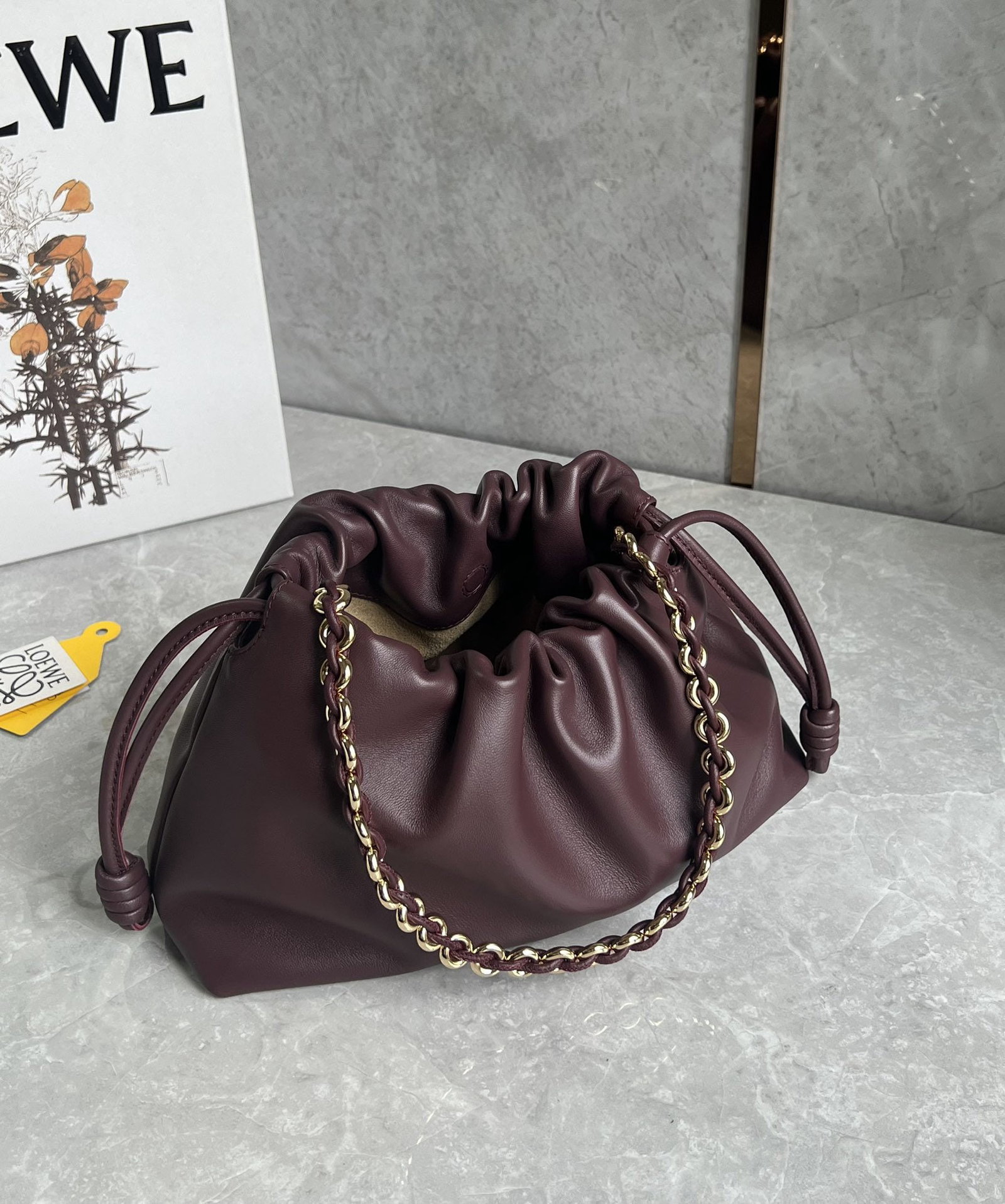LOEWE Flamenco Purse: We offer FREE SHIPPING for both domestic and international clients who bid over $500. LOEWE Flamenco Purse Lucky Bag, maroon color. Features a pleated design and soft lambskin leather with a premium