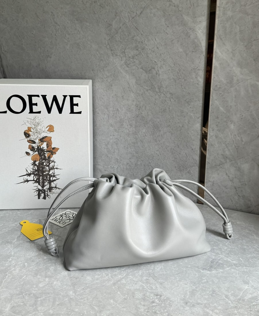 LOEWE: We offer FREE SHIPPING for both domestic and international clients who bid over $500. LOEWE detachable and adjustable shoulder strap, external zip pocket, herringbone cotton canvas lining, Anagram